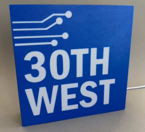 Blue sign with '30th West' text on a gray background