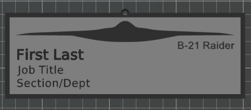 Gray name plate with raised frame, header text fields, top hanging loop